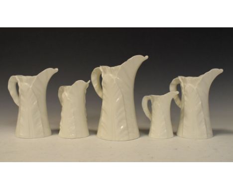 Five Royal Worcester leaf-moulded jugs to include a graduated set of four, largest 18cm high  