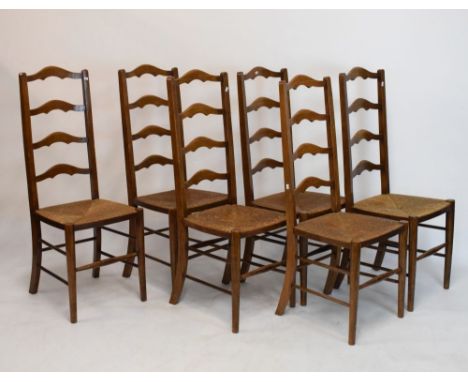 Set of six early 20th Century rush-seated beech or fruitwood ladder back dining chairs  