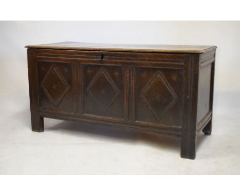 17th/18th Century oak coffer having hinged cover and triple panel front, 126cm wide x 52cm deep x 65cm high  