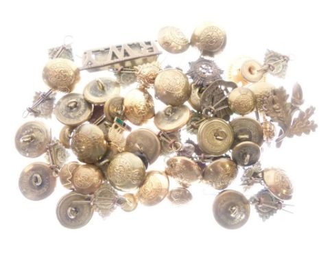 Assorted group of military cap badges and buttons to include; Royal Army Service Corps, enamel 'A United Empire - What We Hav