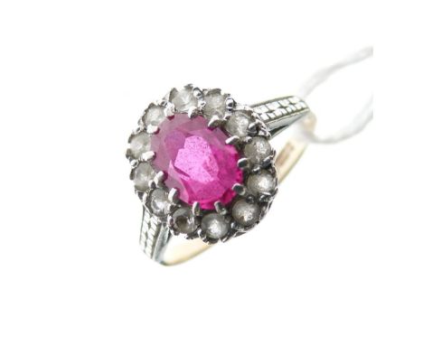 9ct gold cluster ring set central faceted ruby-coloured stone within a border of white stones, 2.1g gross approx  