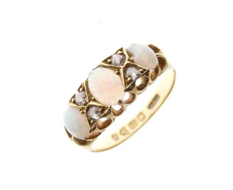 Late Victorian opal and diamond ring, set three oval cabochons and four small diamonds, Chester 1898, size M, 3.8g gross appr