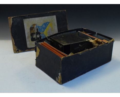 Tin plate magic lantern and slides in printed card box of issue  