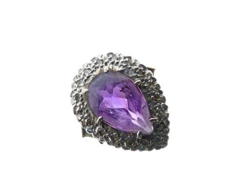 Unmarked yellow metal, diamond and amethyst-coloured stone dress ring of tear drop design with large central stone approximat