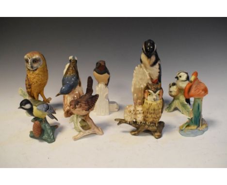 Group of nine Goebel and other porcelain bird figurines to include a Woodpecker, 18cm high  