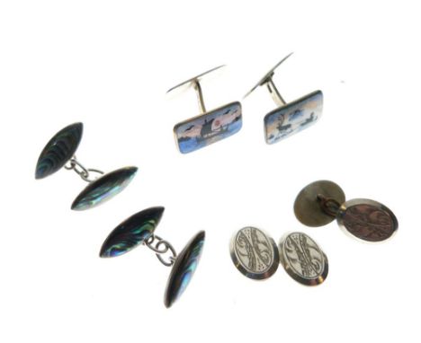 Pair of Norwegian white metal cufflinks, each rectangular panel within enamel decoration of a longboat and a reindeer pulling