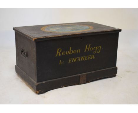 Late 19th/early 20th Century pine trunk having hinged cover with later seaman's chest decoration, the cover with oval panel d
