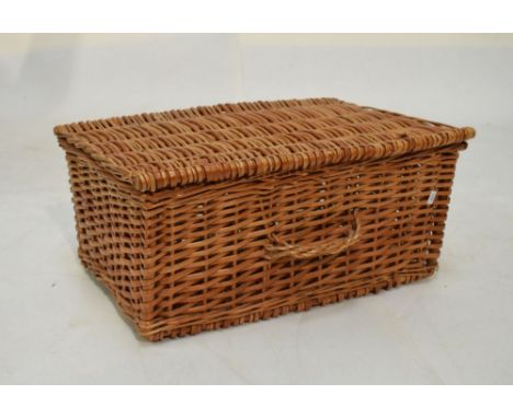 Two seagrass boxes with covers and a wicker hamper  