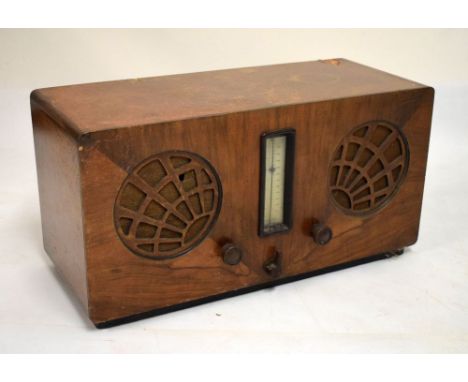 1930's period McMichael twin supervox walnut cased radio fitted Bakelite knobs and sunburst fretwork speaker covers, 63cm wid