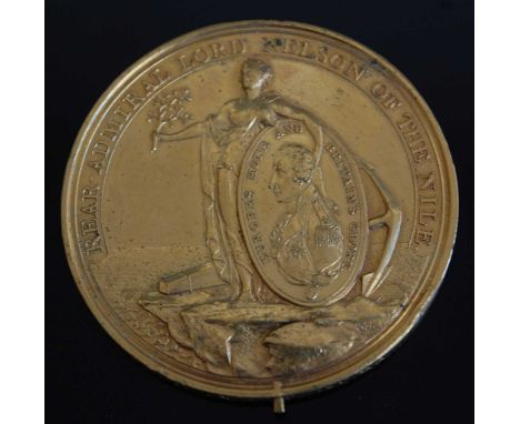 A Davison's Nile Medal (1798) in gilt bronze, obv; Peace caressing a shield decorated with a portrait of Nelson, rev; the Bri