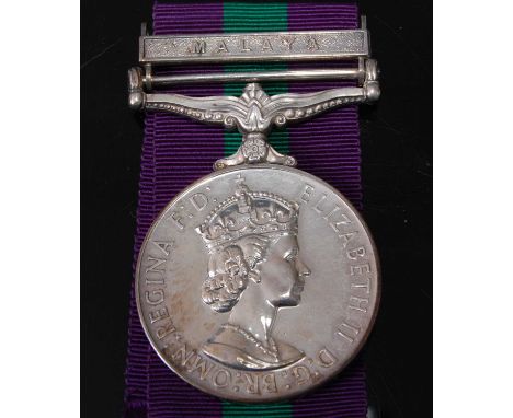 An E.R. II General Service medal (1918-1962) with Malaya clasp, naming 23138011 SIGMN. S.M. DAVIS R. SIGS.