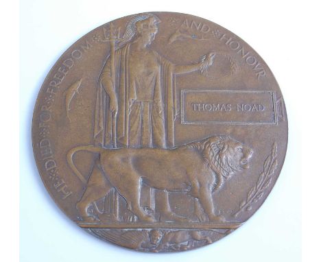 A WW I bronze memorial plaque, naming Thomas Noad.