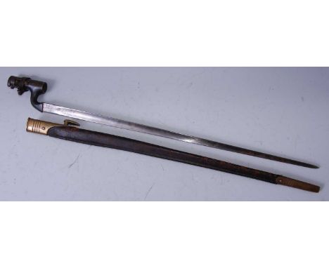 An 1879 pattern Martini Henry socket bayonet, the 54cm blade stamped with War Department mark and various Ordnance marks, hou