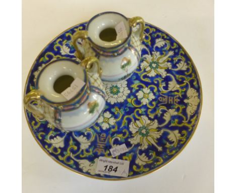 A Chinese circular plate floral detail on a blue enamel back, together with a further pair 20th Century (3)