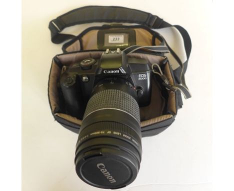A Canon EOS 5000 camera with lens and carrying case.