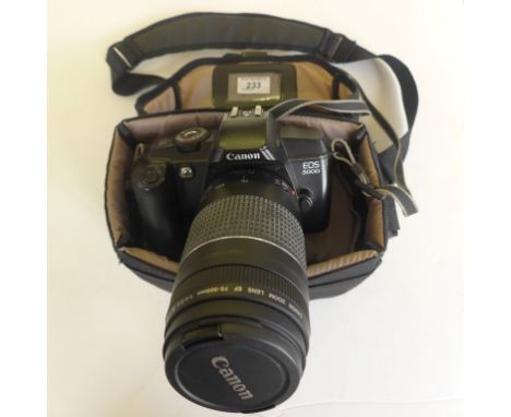 A Canon EOS 5000 camera with lens and carrying case.