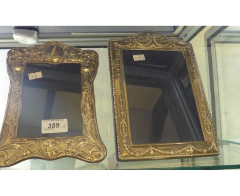 Two contemporary silver mounted easel back photo frames bearing Sheffield hallmarks 