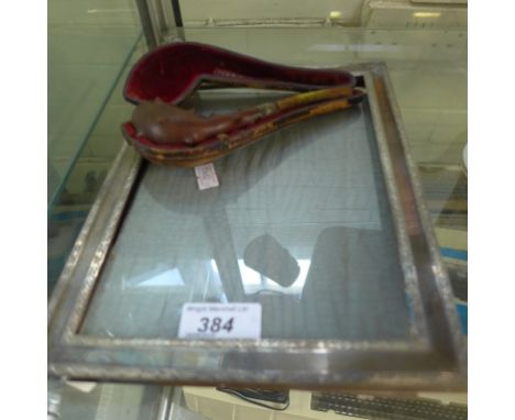 A mixed lot comprising an easel back silver mounted photograph frame together with a silver mounted tobacco pipe (2)