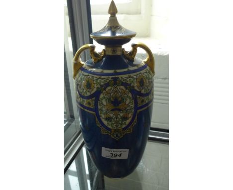 A Royal Worcester lidded double handled vase decorated with Middle Eastern type floral detail registered number to base 67169