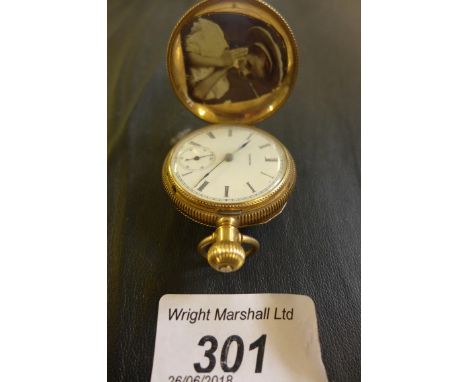 A ladies 14ct gold full Hunter pocket watch, the white enamel face marked Illinois 