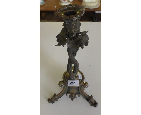 A 19th Century silver-plated three footed candlestick of naturalistic form.