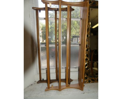 Two Ercol elm hanging plate racks, one medium and one light in colour.