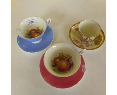 A mixed lot comprising two Shelley floral decorated cups and saucers, together with a further Royal Worcester blush ivory cab