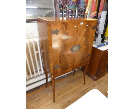 A reproduction mahogany veneered freestanding cocktail cabinet, the twin glazed doors enclosing single fixed shelf and mirror