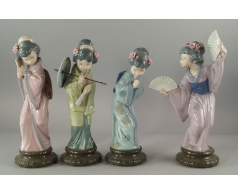 A collection of Lladro figurines of Japanese ladies, 20th century, mostly dressed in kimonos, holding fans, on cylindrical wa