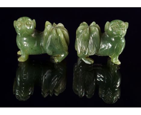 A pair of Chinese jade models of a Pekingese dogs, 20th century, 5cm wide, 
