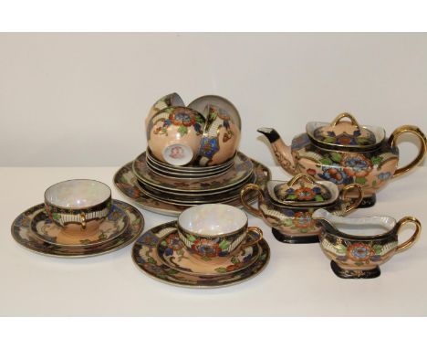 A vintage hand painted eggshell porcelain Oriental tea service 