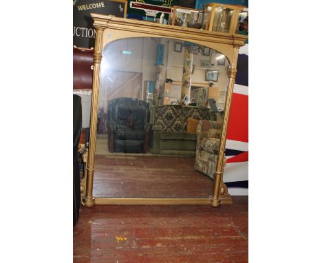 A large antique wooden &amp; gilt framed over mantel mirror