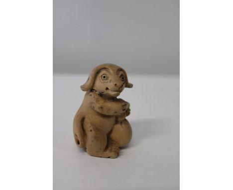 A box wood netsuke in the form of a buffalo