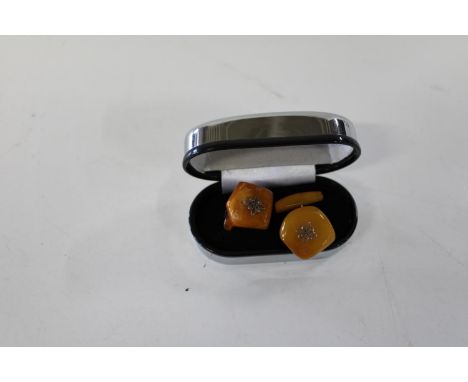 A pair of vintage egg yolk amber cufflinks 