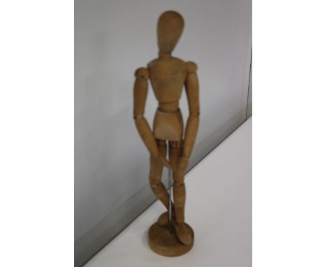 A vintage wooden artist mannequin