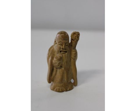 A signed box wood netsuke in the form of an Immortal
