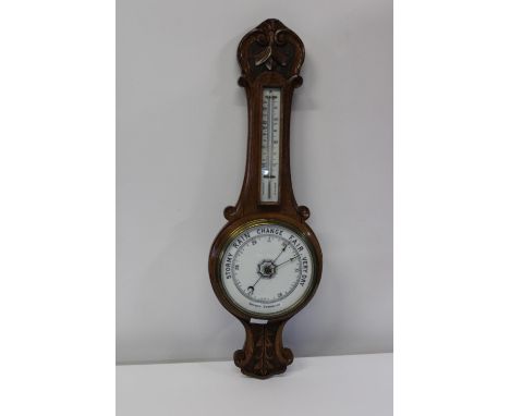An antique oak cased banjo barometer 82cm in length 
