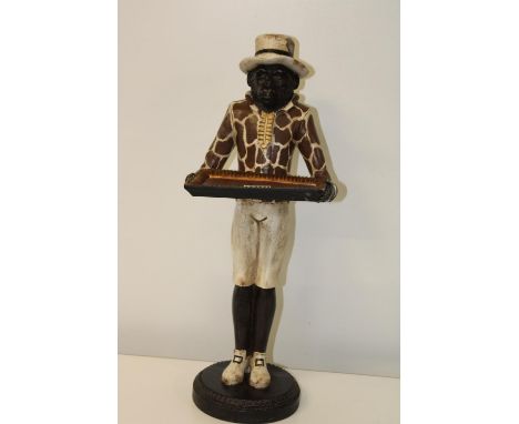 A vintage resin calling card figurine (damage to hat) 