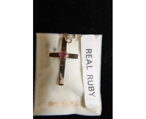 A 9ct gold cross with ruby 