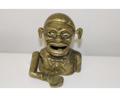 A vintage brass money box 