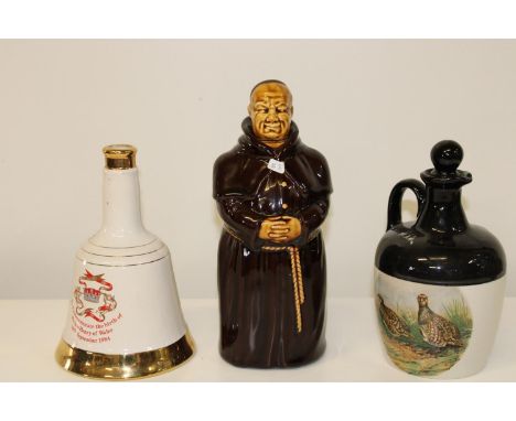 Three collectable ceramic decanters 