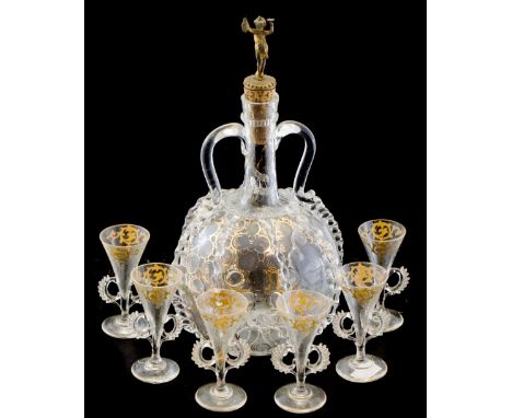 A 19th century Dutch glass decanter, globe form with applied crimped banding and rigaree decoration, twin handled, gilded wit