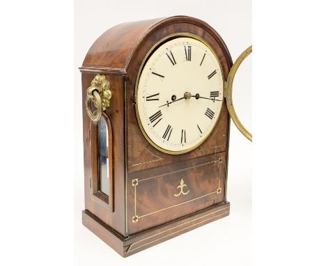 A William IV mahogany bracket clock, c.1830, the 8 inch diameter within a round arch topped case, with gilt handles, brass in