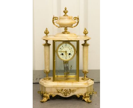 A late 19th century eight day marble mantle clock, applied gilt embellishments and a marble finial, white enamelled dial, 50c