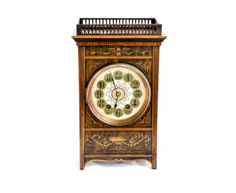 An Edwardian rosewood and marquetry mantle clock, the five inch enamel dial with Arabic numerals and garland decoration, in t