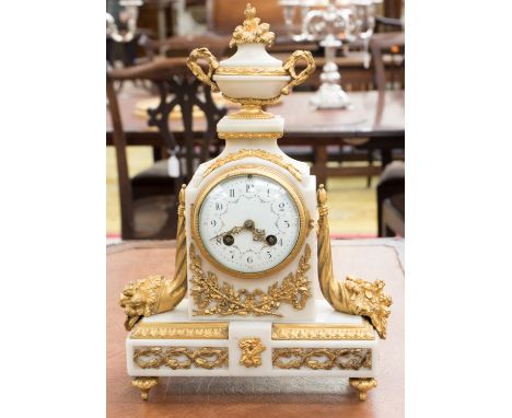 An early 20th century French ormolu mounted white marble mantel clock, Lamuel Moutti, the 3.5 inch dial within a stepped case