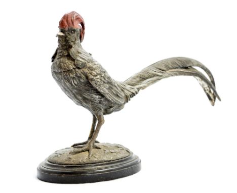 A Victorian cold painted and silvered inkstand, realistically modelled as a cockerel, the head hinged, opening to reveal a ce