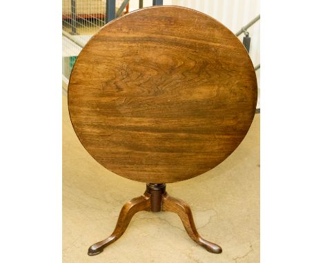 **REOFFER APRIL £100/150A George III mahogany tilt-top tripod table, circa 1770, the single plank top raised on a turned colu