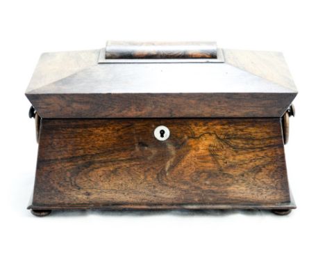 A Regency rosewood tea caddy, of sarcophagus form, with ring handles, fitted interior, approx 35cm wide