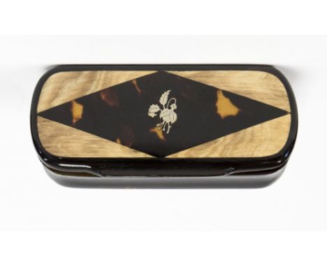A 19th century rectangular horn snuff box, curved ends, inset tortoiseshell cover to form a lozenge, white metal floral pique